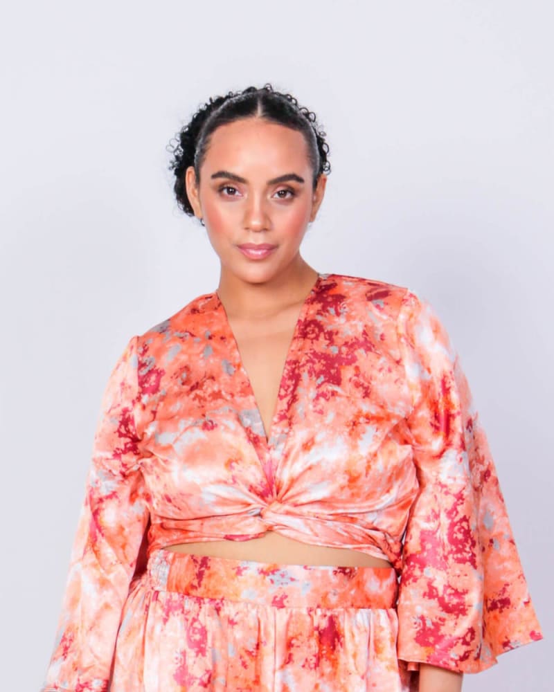Front of a model wearing a size L Donny & Marie Wrap Crop Top in Rosey Swirl by LuvMeMore. | dia_product_style_image_id:266569